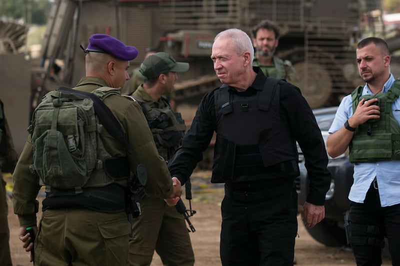 Yoav Gallant shakes the hand of an Israeli soldier 