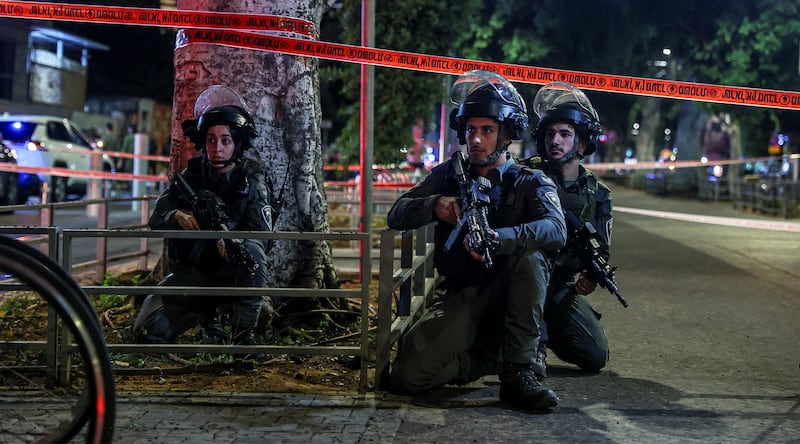 Israeli border police take position at the site of a fatal shooting attack in Jaffa.