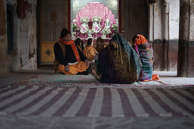 Pilgrims offering prayers inside the temple beside Ram Mandir.