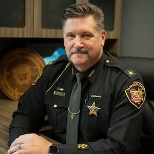 Portage County Sheriff Bruce Zuchowski poses at his desk.