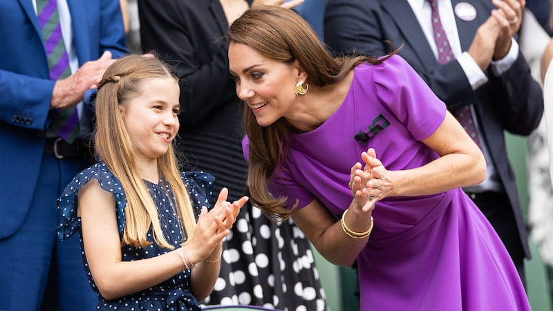 Catherine, Princess of Wales talks with Princess Charlotte of Wales at Wimbledon on July 14, 2024 in London, England.