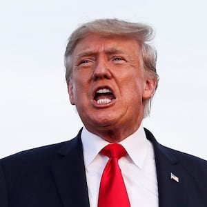 President Donald Trump reacts during his first post-presidency campaign rally at the Lorain County Fairgrounds in Wellington, Ohio, June 26, 2021. 