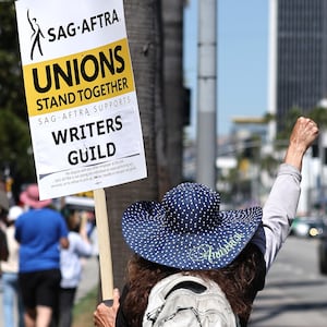 SAG-AFTRA members walk the picket line in solidarity with striking WGA workers.