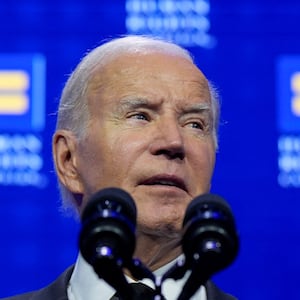 Joe Biden speaks on stage at an event.