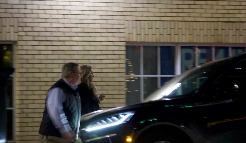 Tim Moore and Jamie Lassiter leaving Sullivan's Steakhouse together, as shown in court documents.