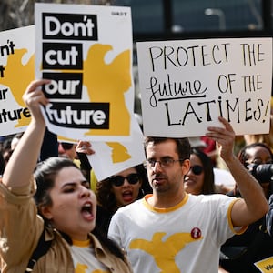 L.A. Times Guild journalists rally in front of City Hall to protest against layoffs and changes to job seniority protections during a walkout of the Los Angeles Times newspaper.