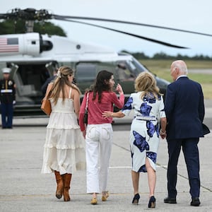 US President Joe Biden (R), First Lady Jill Biden and family walk to Marine One upon arrival at Francis S. Gabreski Airport in Westhampton Beach, New York on June 29, 2024.