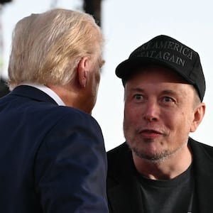 Tesla CEO Elon Musk joins Donald Trump during a campaign rally at site of his first assassination attempt in Butler, Pennsylvania, on Oct. 5, 2024.