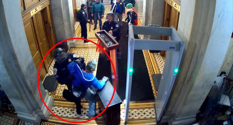 Pastucci seen fighting a police officer inside the Capitol.