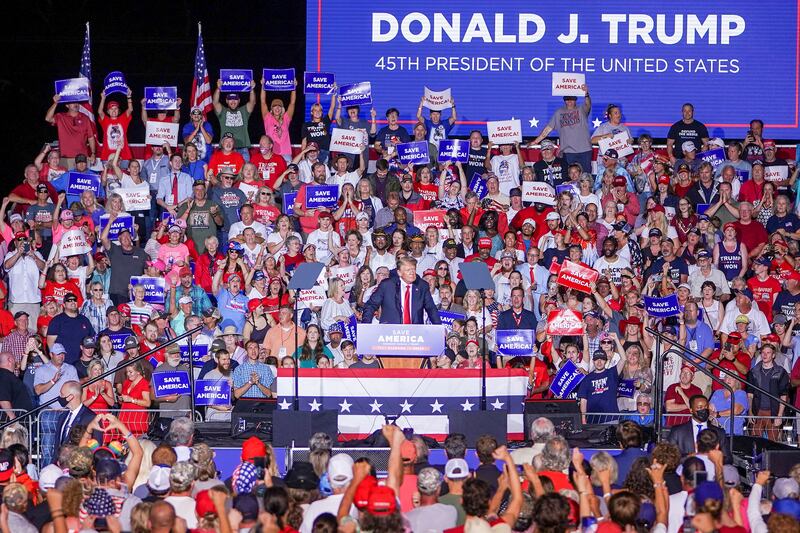 The crowd reacts during former President Donald Trump as he speaks during a rally in Cullman, Alabama.