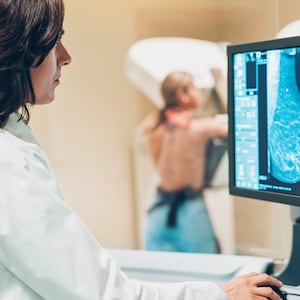 Doctor and patient making a mammography