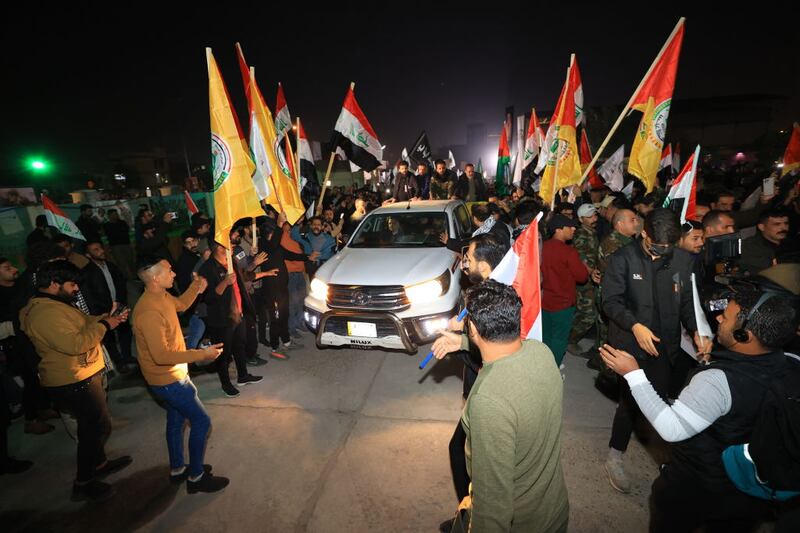 People attend the funeral ceremony of Abu Taqwa Al-Saidi and his close bodyguard, who was killed in the US airstrike in Baghdad, Iraq.