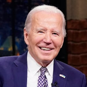 President Joe Biden talks with host Seth Meyers