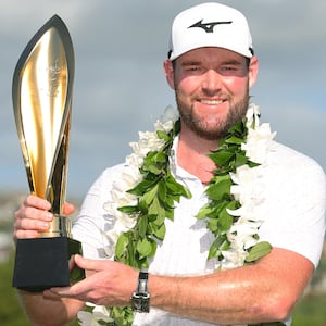 Grayson Murray of the United States poses with the trophy after winning the Sony Open in Hawaii in January.