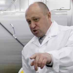 Yevgeny Prigozhin shows Russian Prime Minister Vladimir Putin on a tour of a factory in 2010.