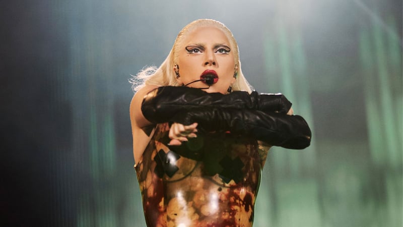 Lady Gaga crosses her arms during the Chromatica concert.