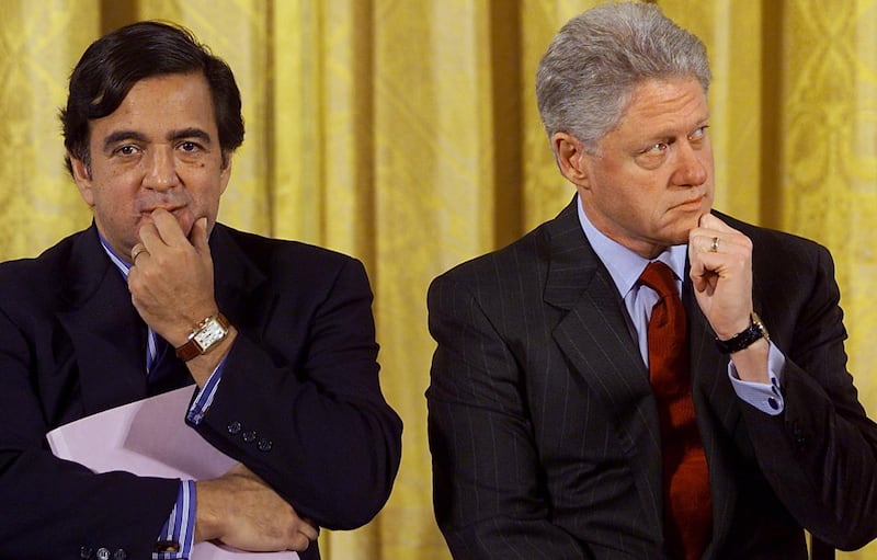 US President Bill Clinton (R) sits with Secretary of Energy Bill Richardson (L) in February 2000.  