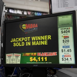 A photo of a lottery terminal at Hometown Gas & Grill, where John Doe won his $1.35 billion prize.