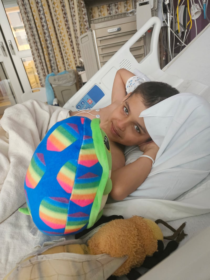 Aedrik Quinn, 8, rests in a hospital bed after his symptoms finally compelled doctors to order genetic testing.