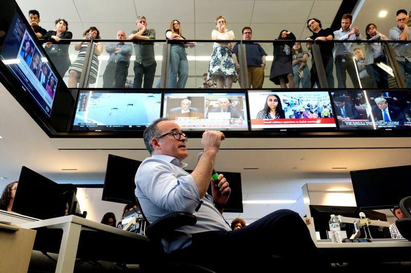 Matt Murray gives a speech in front of workers of the Washington Post