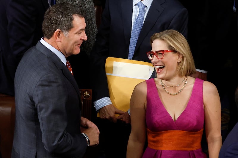 Senator Kyrsten Sinema (I-AZ) reacts as she arrives prior to Israeli President Isaac Herzog's address at a joint meeting of Congress.