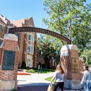 Gainesville, University of Florida, campus entrance with students.