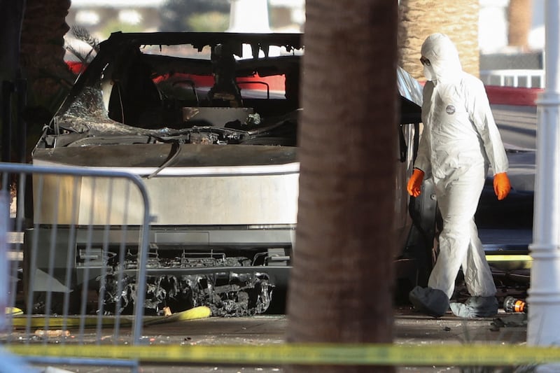 The remains of a Tesla Cybertruck that burned at the entrance of Trump Tower, are inspected in Las Vegas, Nevada, U.S.