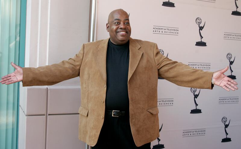 Reginald Johnson poses as he arrives for an event celebrating TV dads.