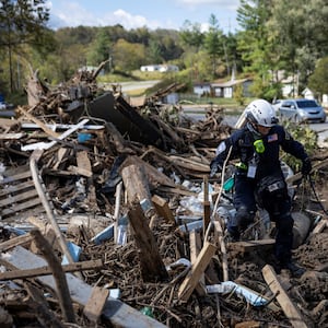 Rescue workers search amid debris