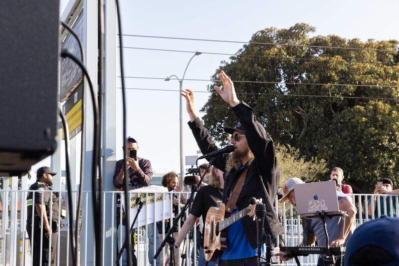 MAGA pastor Sean Feucht plays guitar at a “United for Israel” march against recent campus protests.