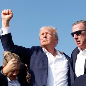 Donald Trump is rushed offstage after being shot during a rally on July 13 in Butler, Pennsylvania.