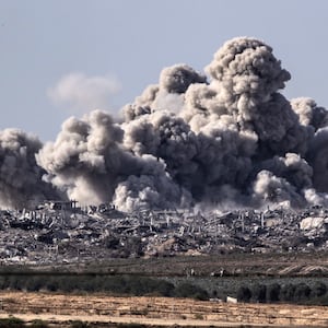 A picture of smoke rising over destroyed buildings in Gaza 