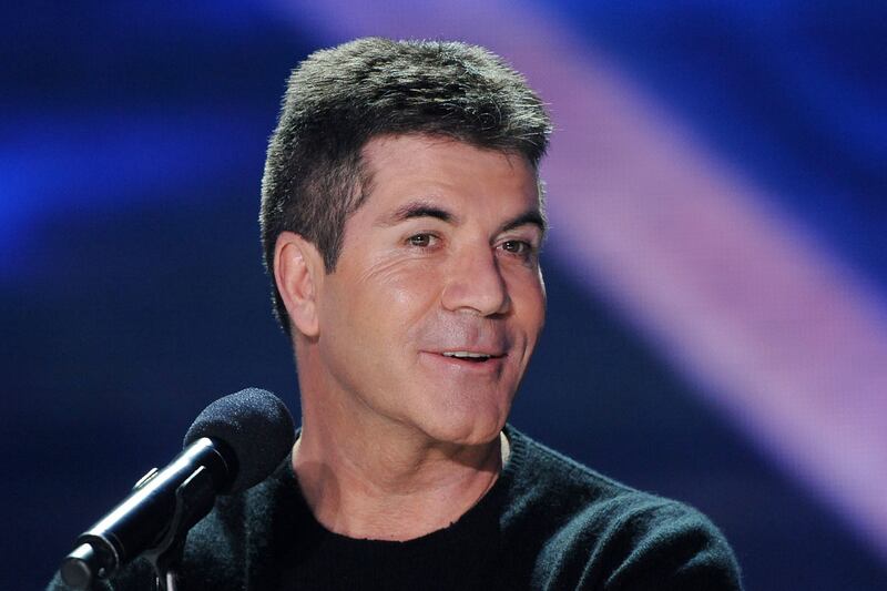 articles/2012/05/01/6-juicy-bits-from-sweet-revenge-the-intimate-life-of-simon-cowell/simon-cowell-speed-read-crocker-tease_robwwy