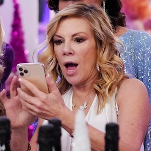 Ramona Singer looks at a phone with a shocked expression in "The Real Housewives of New York"