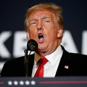 Former U.S. President and Republican presidential candidate Donald Trump speaks during a "Commit to Caucus" event for his supporters in Coralville, Iowa