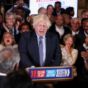 Former British Prime Minister Boris Johnson is applauded as he arrives to speak during a Conservative general election campaign event in London, Britain, July 2, 2024.