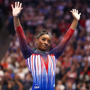 Simone Biles celebrates her floor routine during the U.S. Olympic Team Gymnastics Trials at Target Center. 