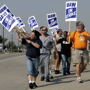 United Auto Workers (UAW) union members picket outside the General Motors Powertrain plant in Warren, Michigan