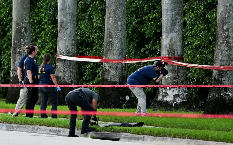 Investigators photographing evidence