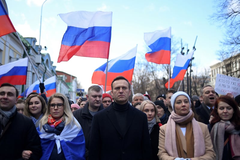 Russian opposition leader Alexei Navalny, his wife Yulia Navalnaya, opposition politician Lyubov Sobol and other demonstrators march in memory of murdered Kremlin critic Boris Nemtsov in downtown Moscow.