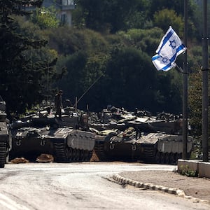 Israeli tanks are seen on a road near Israel's border with Lebanon, in northern Israel, October 12, 2023.