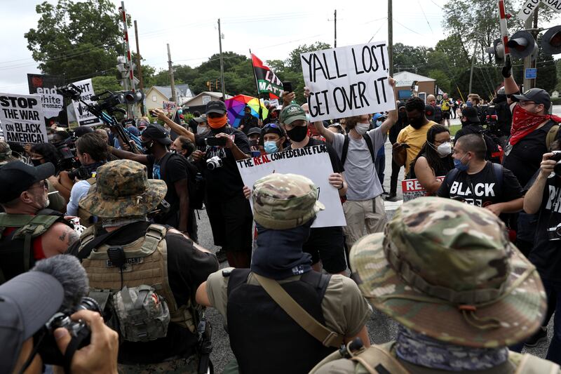 2020-08-15T151958Z_1401147787_RC2FEI92XII6_RTRMADP_3_GLOBAL-RACE-PROTESTS-STONE-MOUNTAIN_vncihb