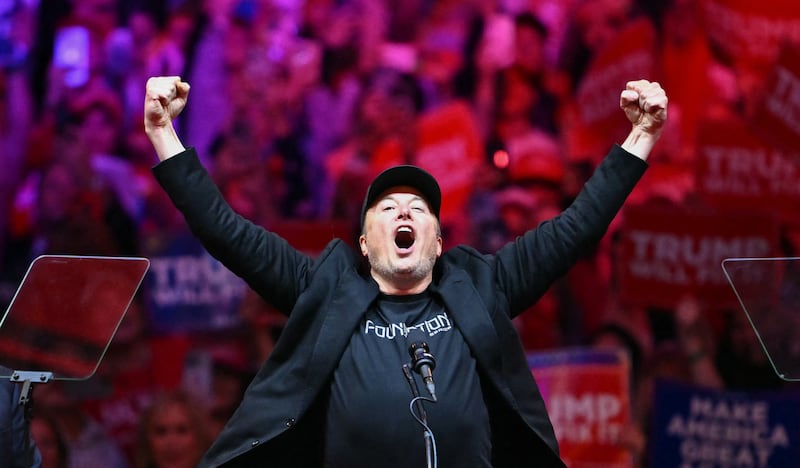 Tesla and SpaceX CEO Elon Musk gestures as he steps on stage during a rally for former US President and Republican presidential candidate Donald Trump at Madison Square Garden in New York, October 27, 2024.