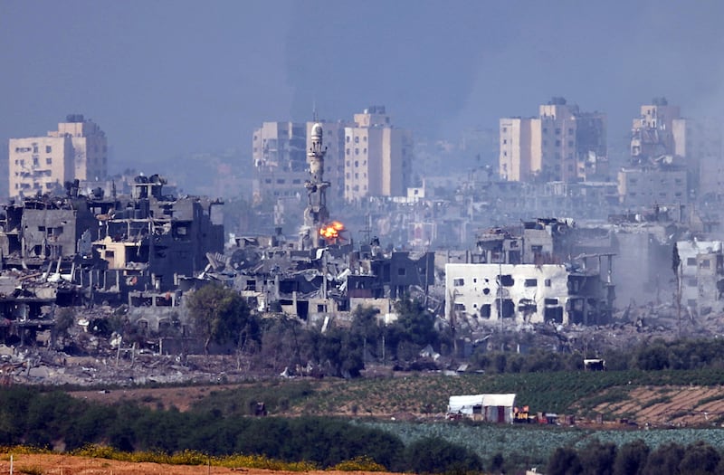 A photograph of a missile strike behind a minaret in Gaza on October 28, 2023 seen from Sderot, Israel