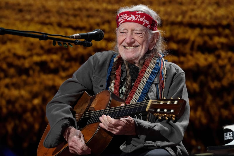 Photograph of Willie Nelson performing