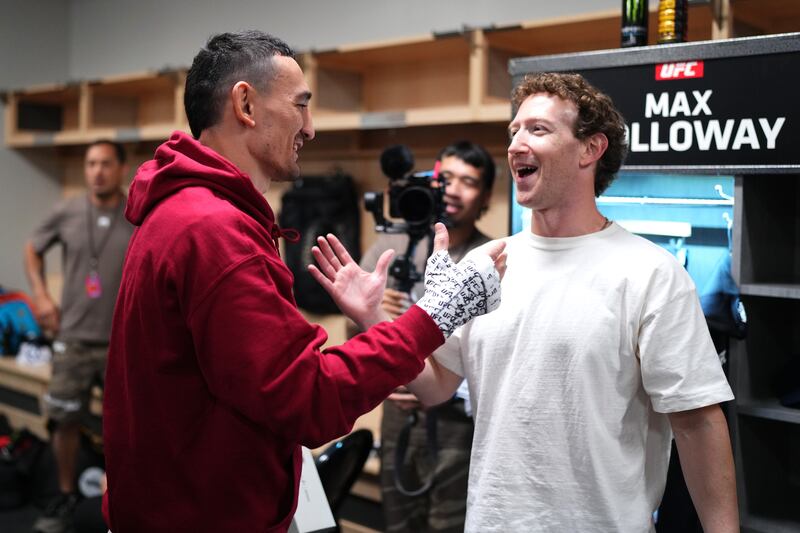 Mark Zuckerberg greeting a UFC fighter