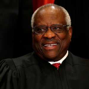 U.S. Supreme Court Justice Clarence Thomas participates in taking a new "family photo" with his fellow justices at the Supreme Court building in Washington, D.C., U.S., June 1, 2017.