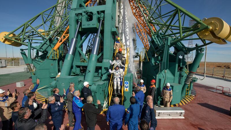 American astronaut Nick Hague and Russian cosmonaut Alexey Ovchinin disembarking from soyuz