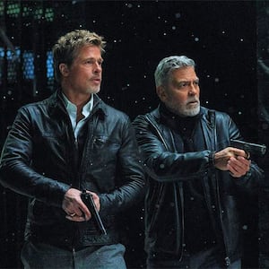 A photo still of Brad Pitt and George Clooney in Wolfs