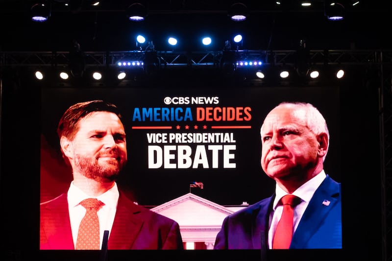 A monitor shows the faces of Minnesota Gov. Tim Walz and Ohio Sen. JD Vance ahead of the vice presidential debate earlier this month.